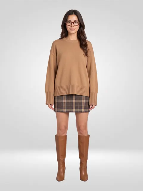 Camel sweater, plaid mini skirt, tan knee-high boots and glasses