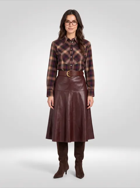 Plaid western shirt, leather midi skirt with belt, suede boots and glasses